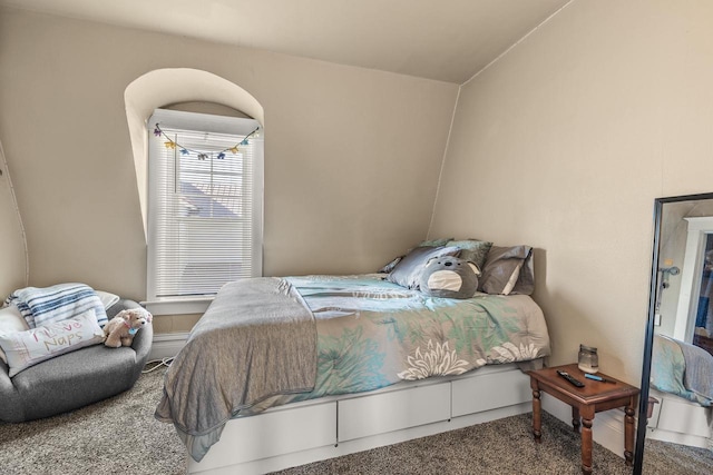 bedroom featuring carpet flooring and vaulted ceiling