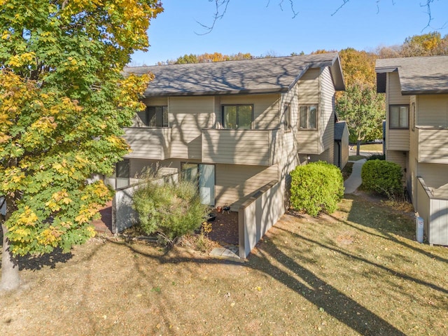 view of home's exterior with a yard