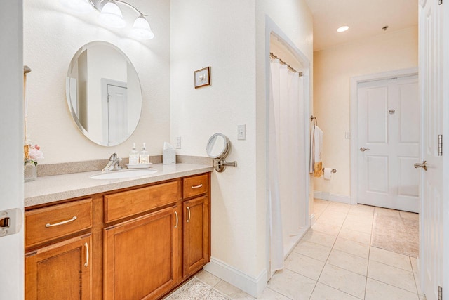 bathroom featuring vanity and tile patterned flooring