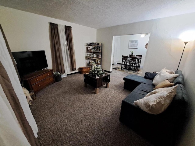 carpeted living room featuring a textured ceiling