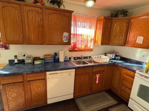 kitchen with white appliances and sink