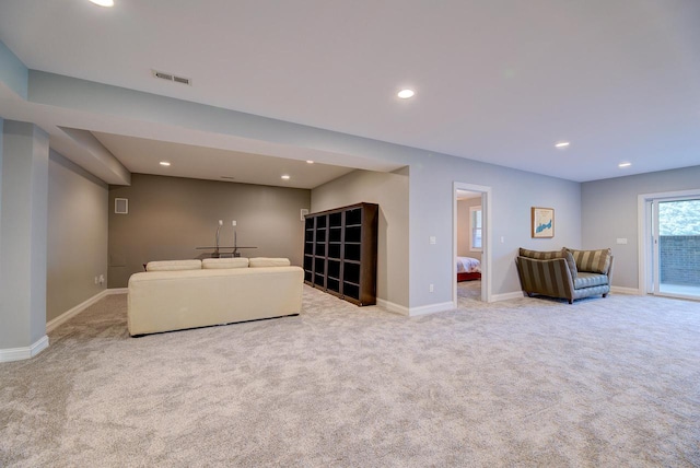 living room featuring light carpet