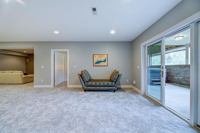 living area featuring carpet floors