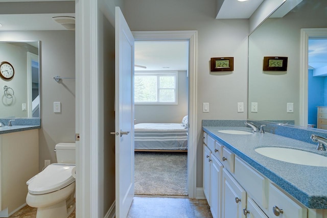 bathroom with vanity and toilet