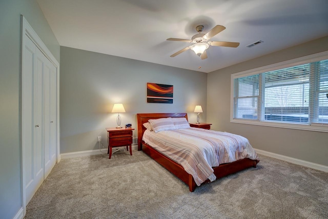 bedroom with carpet, a closet, and ceiling fan