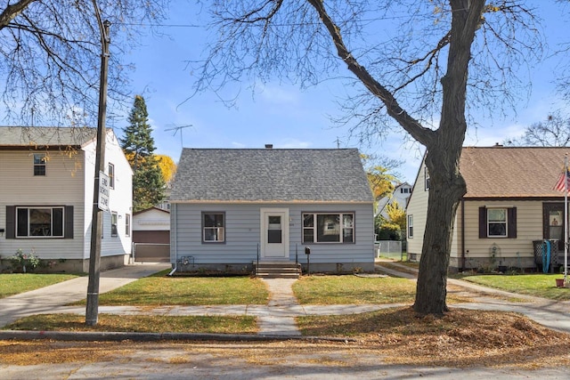 bungalow-style home featuring a front yard