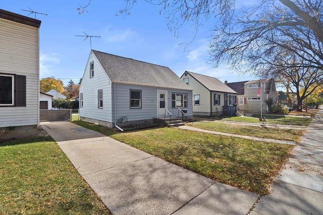 bungalow-style house with a front yard