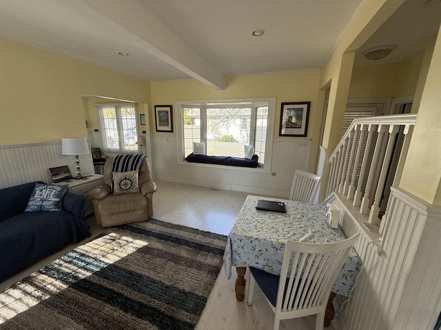 living room with beam ceiling and hardwood / wood-style flooring