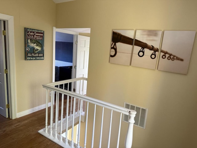 corridor with dark hardwood / wood-style floors