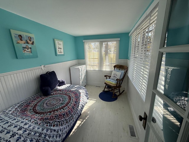 bedroom with light hardwood / wood-style flooring