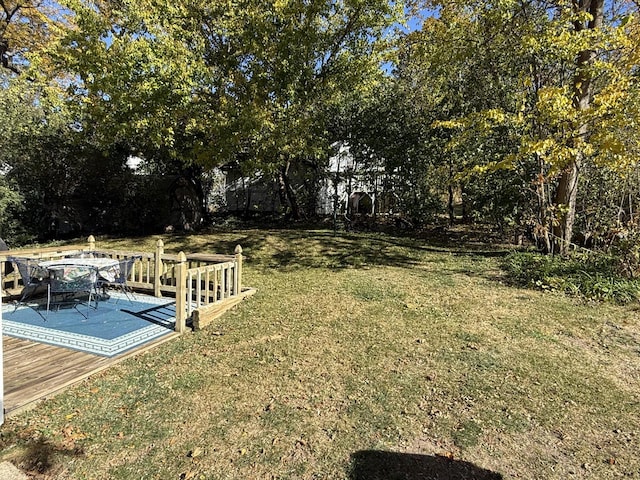 view of yard with a wooden deck