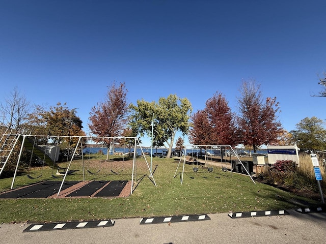 view of playground with a lawn