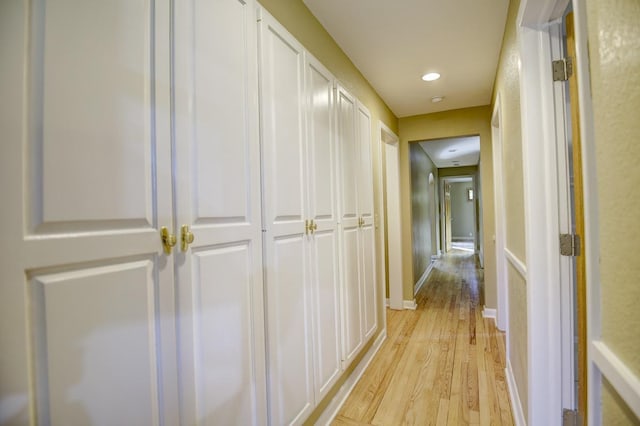 hallway with light wood-type flooring