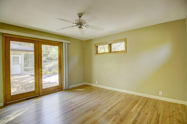 spare room featuring light hardwood / wood-style flooring and ceiling fan