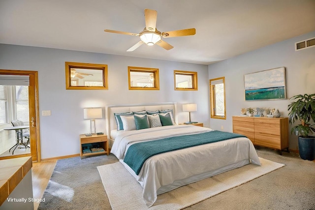 bedroom featuring ceiling fan and light hardwood / wood-style floors