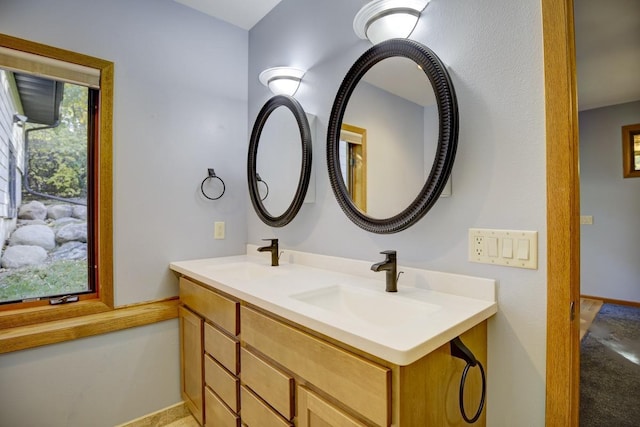 bathroom with vanity and plenty of natural light