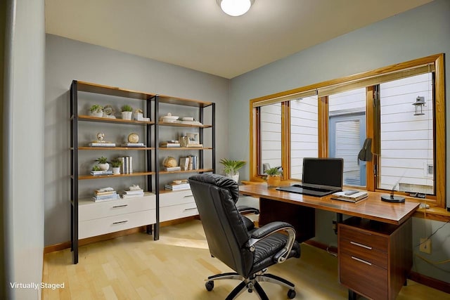 office area with light hardwood / wood-style flooring