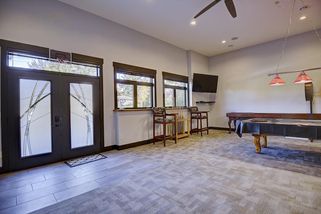 rec room featuring french doors, ceiling fan, a wealth of natural light, and pool table