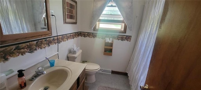 bathroom with vanity and toilet