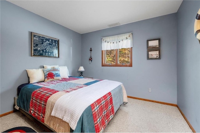 bedroom with light carpet