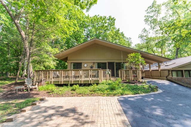 view of front of property with a wooden deck