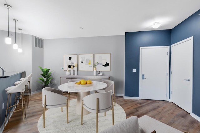 dining room featuring hardwood / wood-style flooring