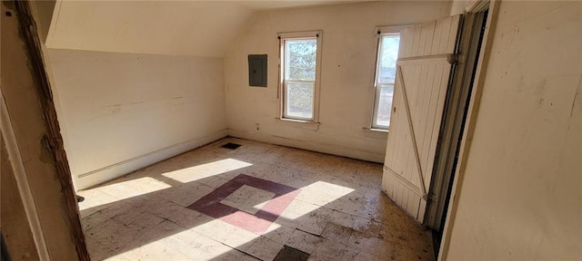 bonus room with electric panel, visible vents, and vaulted ceiling