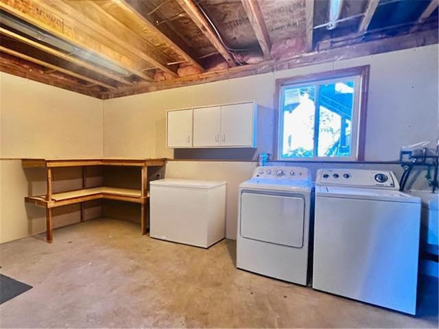 laundry room featuring cabinets and separate washer and dryer