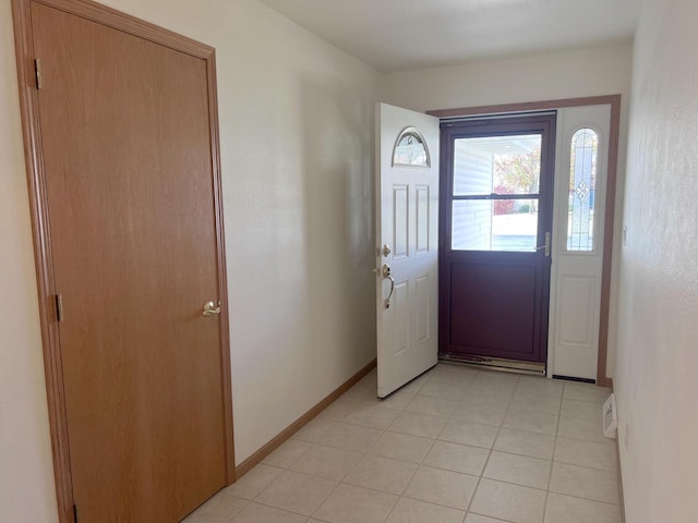 foyer entrance featuring light tile patterned flooring