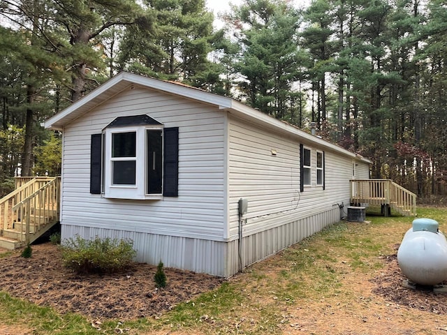 view of side of property with a deck