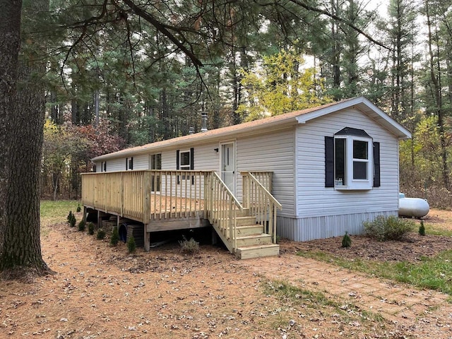 manufactured / mobile home with a wooden deck