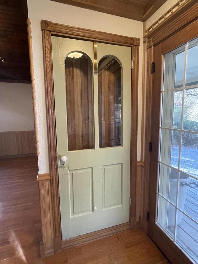 doorway with dark hardwood / wood-style flooring