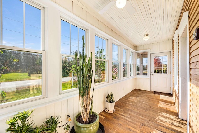 unfurnished sunroom with wooden ceiling