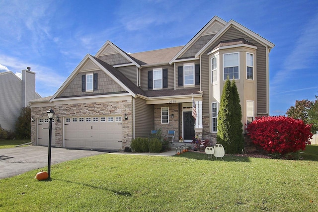 craftsman-style house with a garage and a front lawn