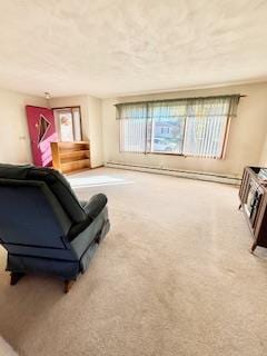 living room featuring a baseboard heating unit and carpet flooring