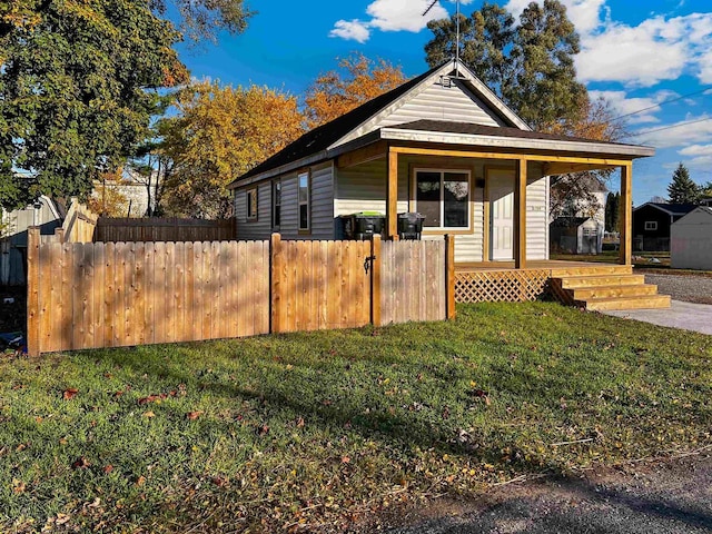 view of front of house featuring a front lawn and a porch