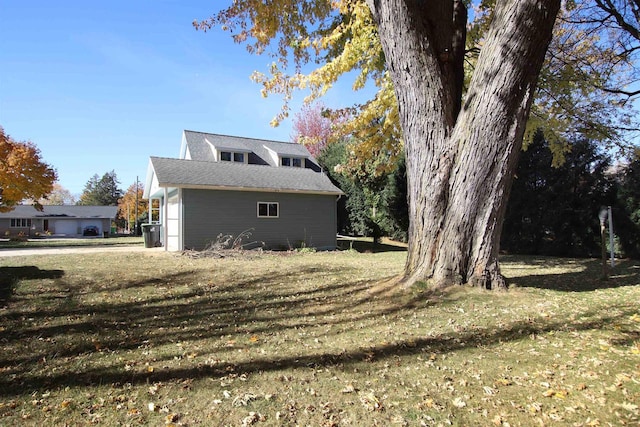 view of home's exterior featuring a lawn