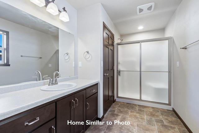 bathroom featuring vanity and walk in shower