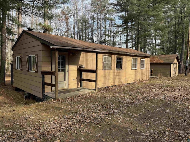 exterior space with a storage shed