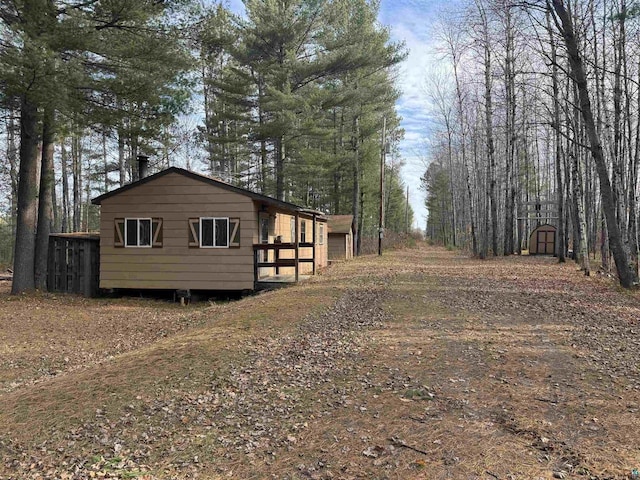 view of home's exterior featuring a storage shed