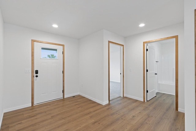 entrance foyer with light hardwood / wood-style flooring