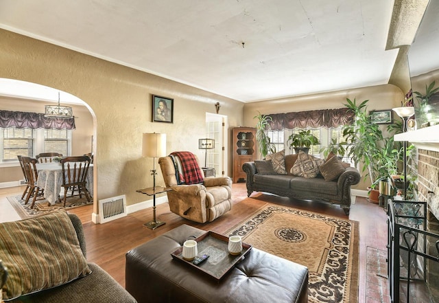 living room featuring a fireplace and dark hardwood / wood-style floors