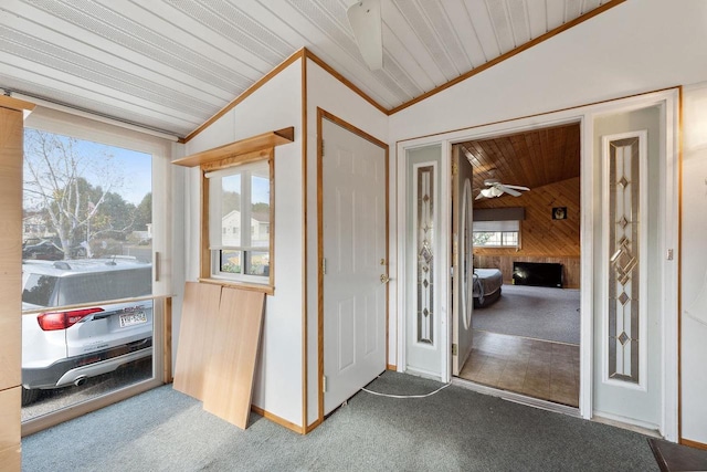 interior space featuring wood ceiling, vaulted ceiling, and ceiling fan