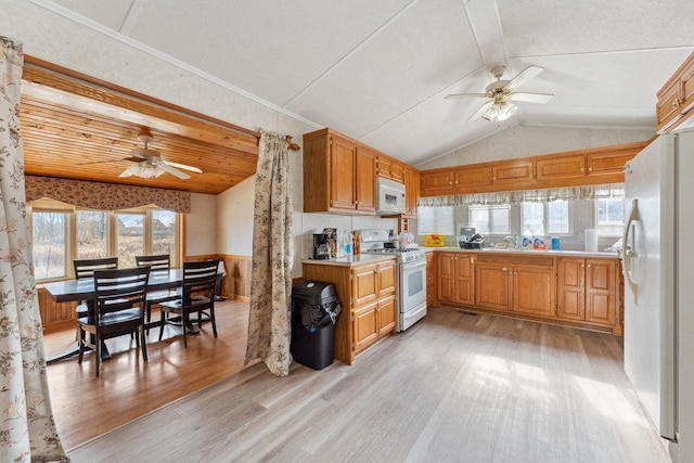 kitchen with lofted ceiling, ceiling fan, light wood-type flooring, and white appliances