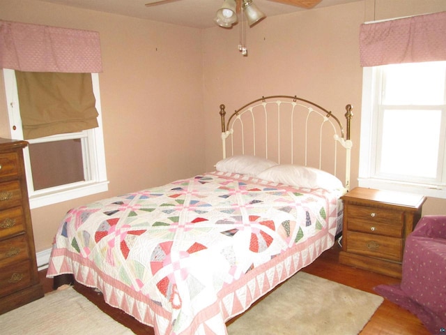 14770 Touve Rd, Herbster, WI 54844 - bedroom with wood finished floors and a ceiling fan