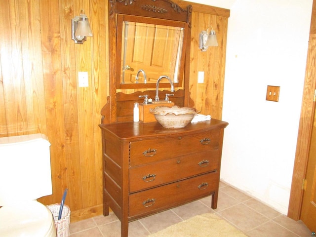 14770 Touve Rd, Herbster, WI 54844 - bathroom with vanity, wood walls, toilet, and tile patterned flooring