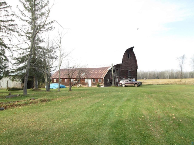 14770 Touve Rd, Herbster, WI 54844 - view of green lawn with a barn and an outbuilding