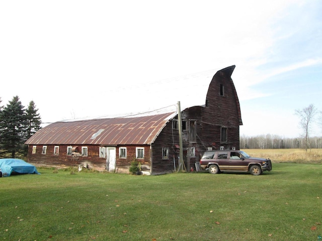 14770 Touve Rd, Herbster, WI 54844 - view of side of property with a barn, a yard, and an outbuilding