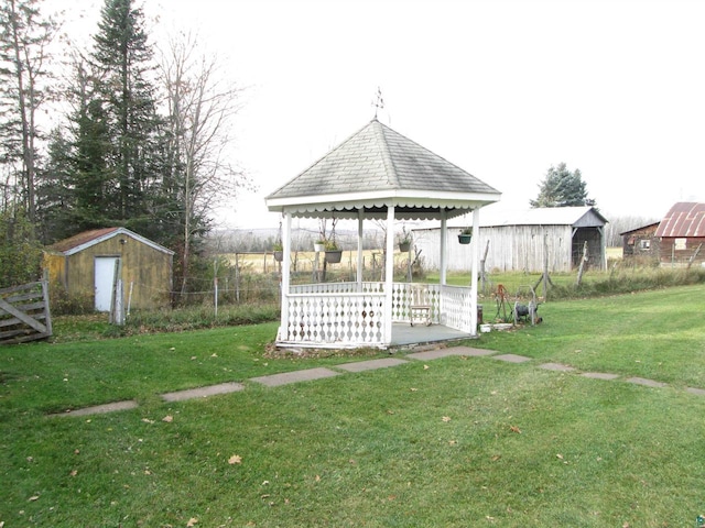 view of yard with a gazebo and a shed