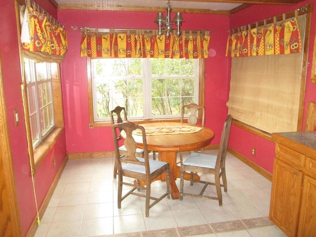 14770 Touve Rd, Herbster, WI 54844 - dining room with healthy amount of natural light, baseboards, and light tile patterned floors